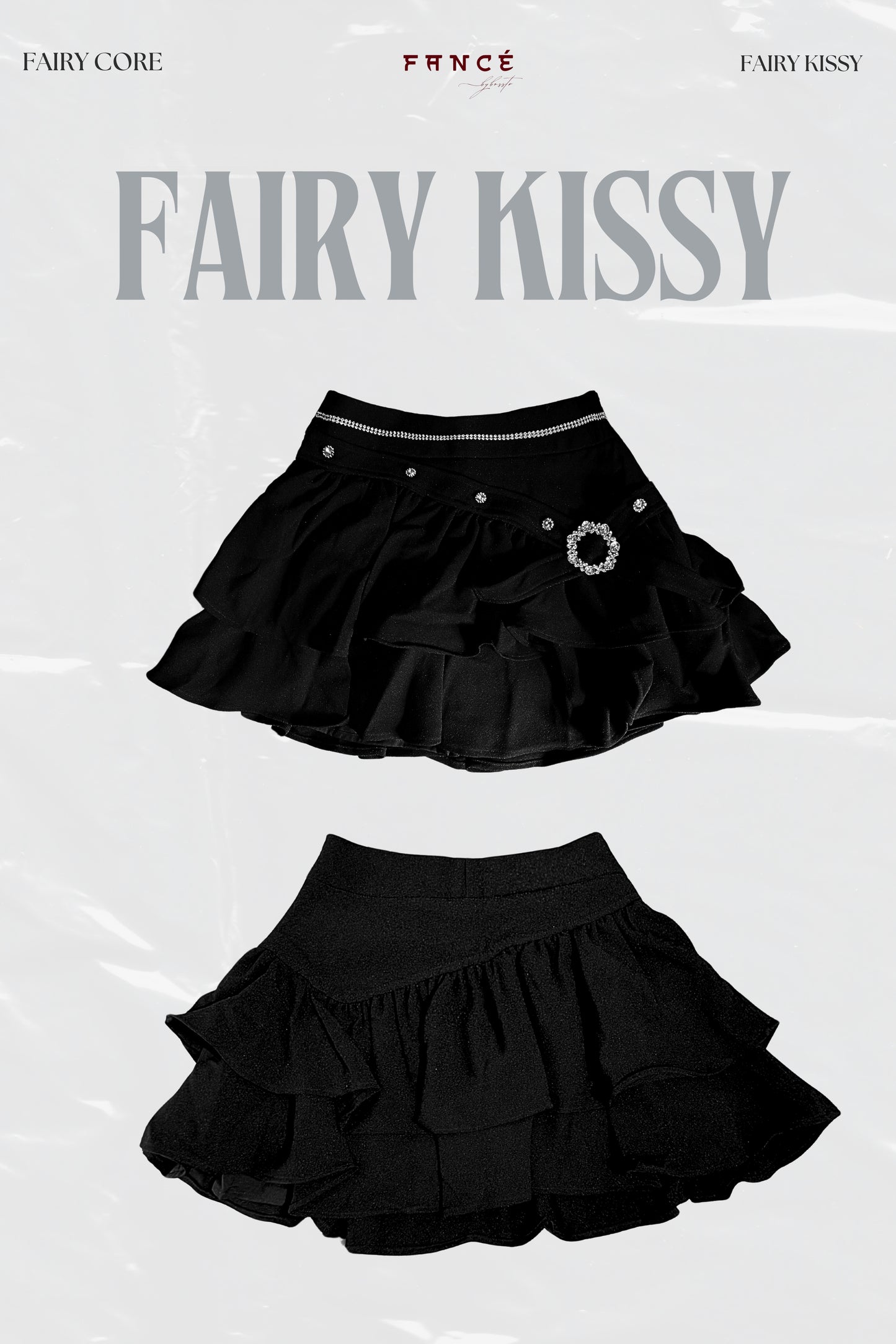 Black ruffled skirt with decorative elements on a white background, featuring the brand 'Fairy Kissy'.