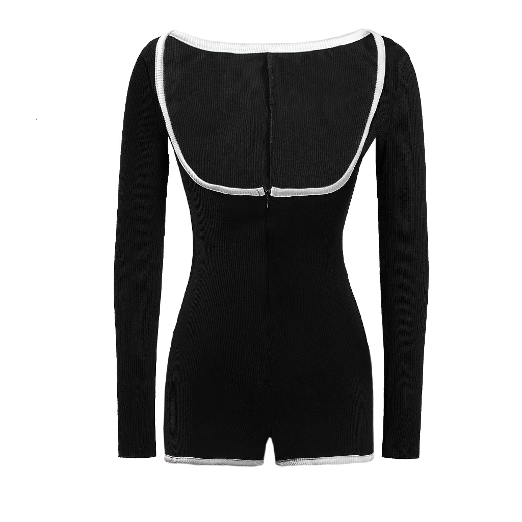 Black bodysuit with white trim on a white background