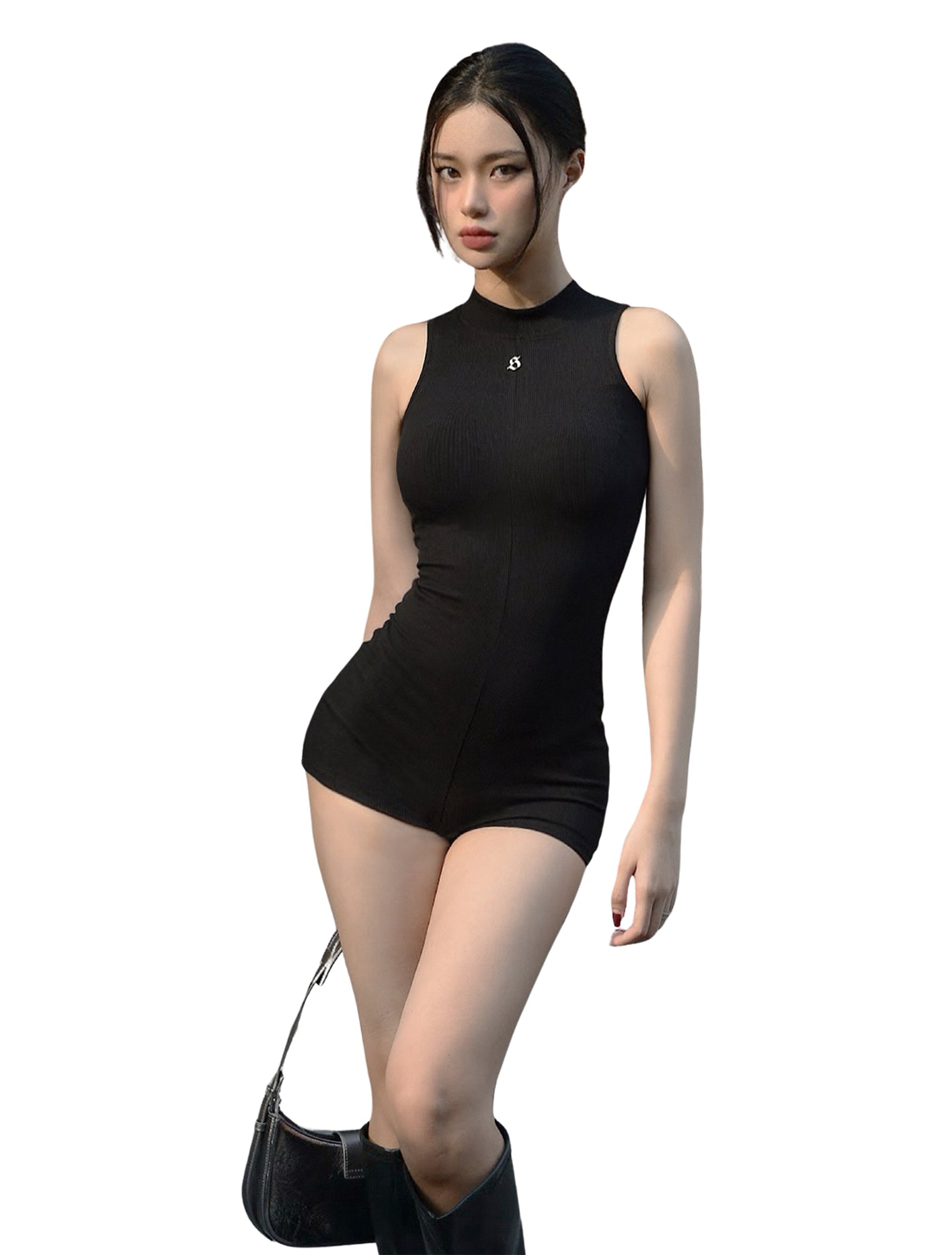 Woman wearing a black sleeveless bodysuit on a white background