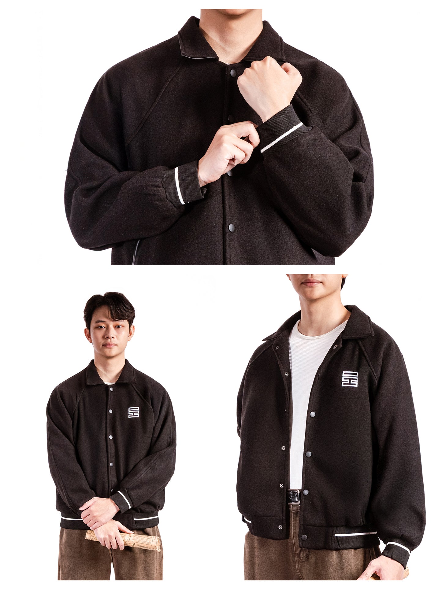Black varsity jacket with white trim worn by a person on a white background