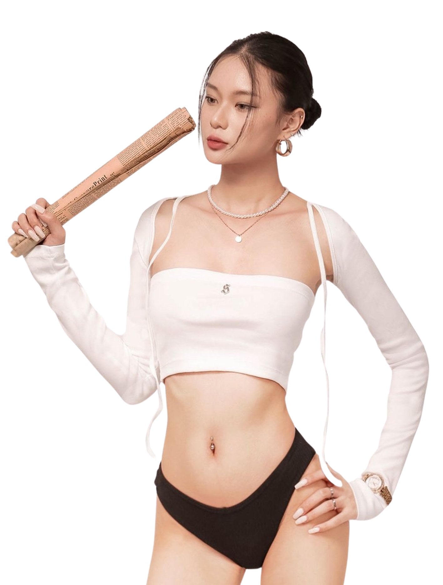 Woman holding a wooden bat wearing a white sports bra and black shorts on a white background