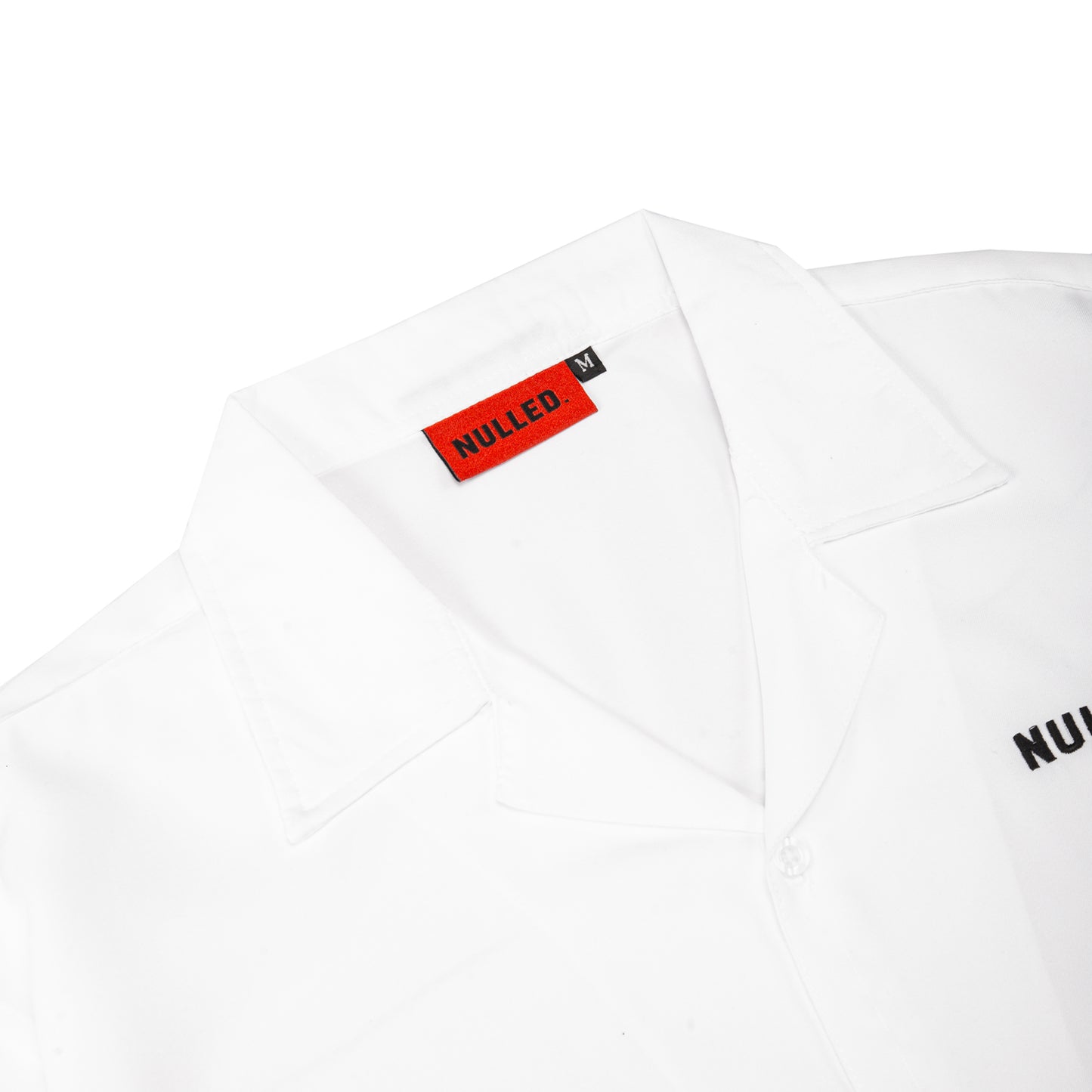 White t-shirt with 'NULLED' logo on a white background
