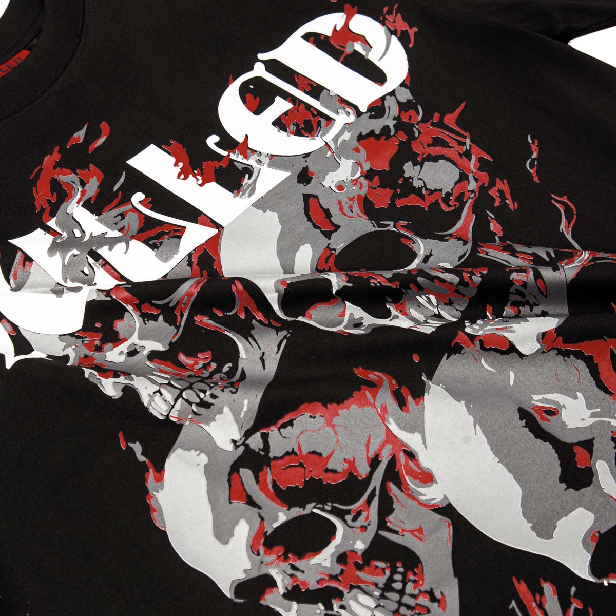 Black t-shirt with red, gray, and white graphic design on a black background