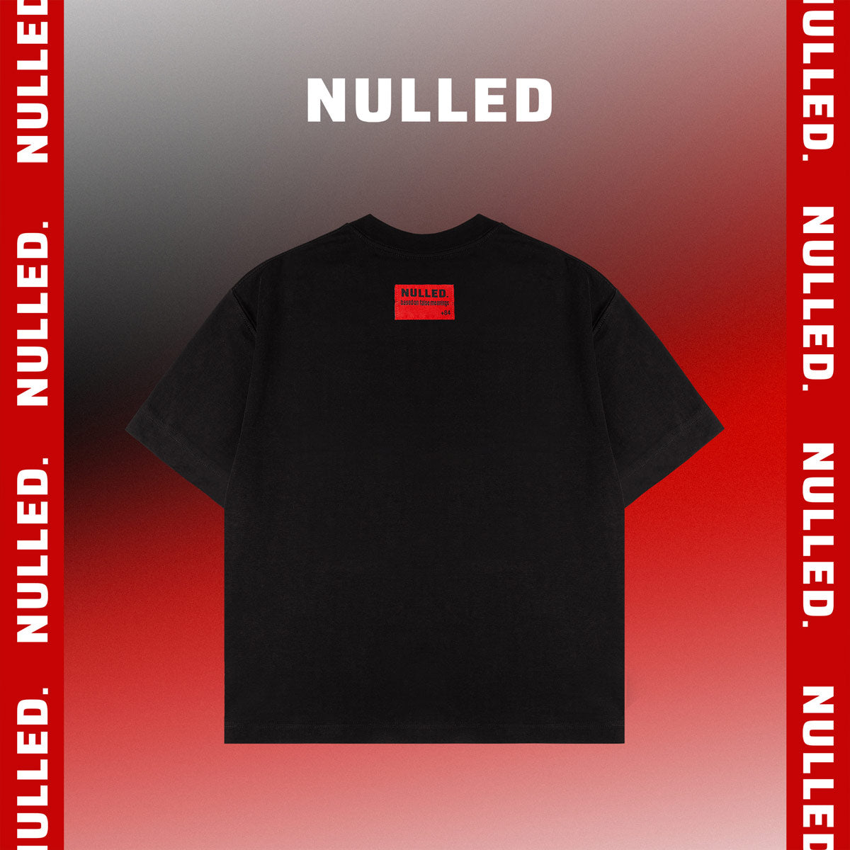 Black t-shirt with 'NULLED' label on a red and gray gradient background