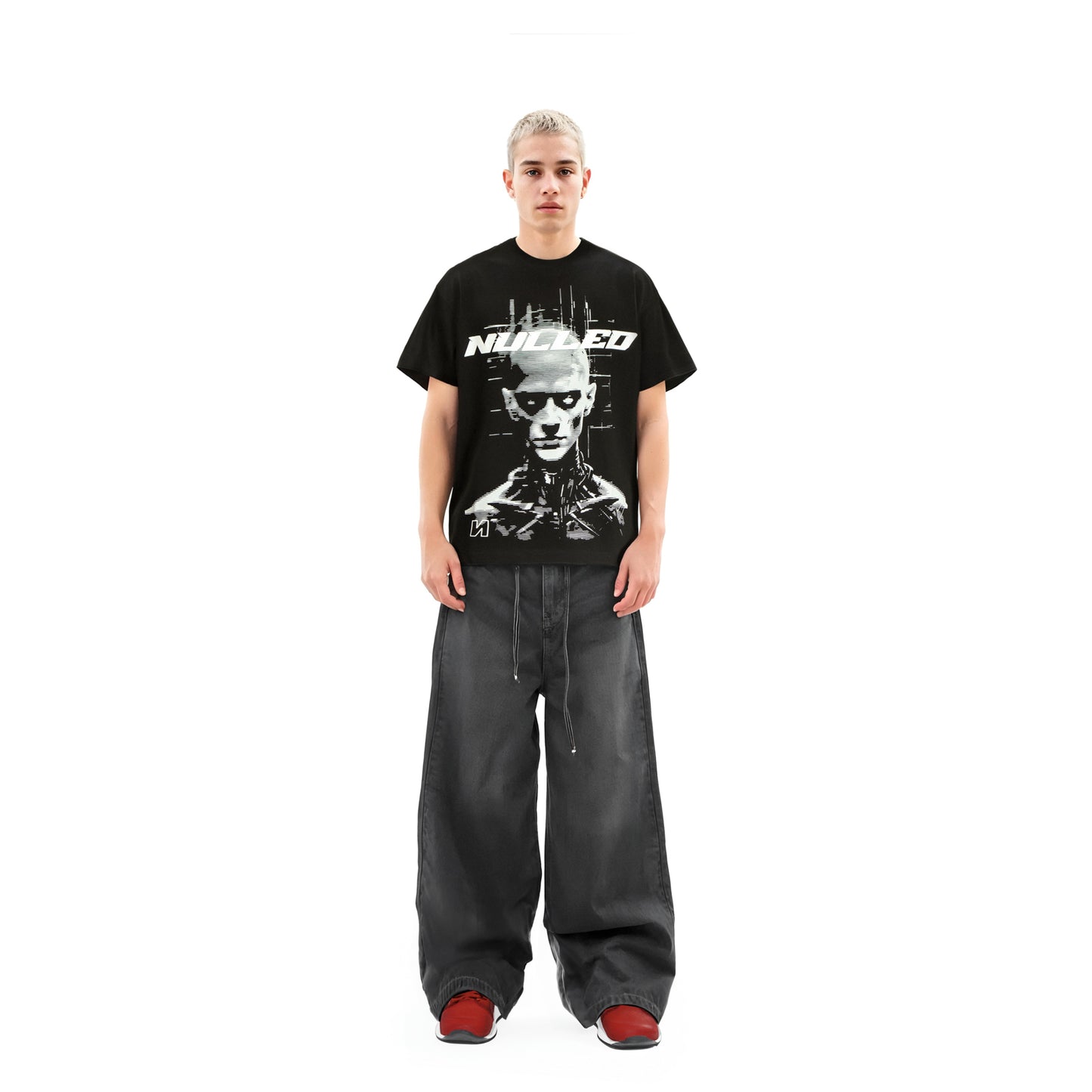 Person wearing a black t-shirt with a graphic design on a white background