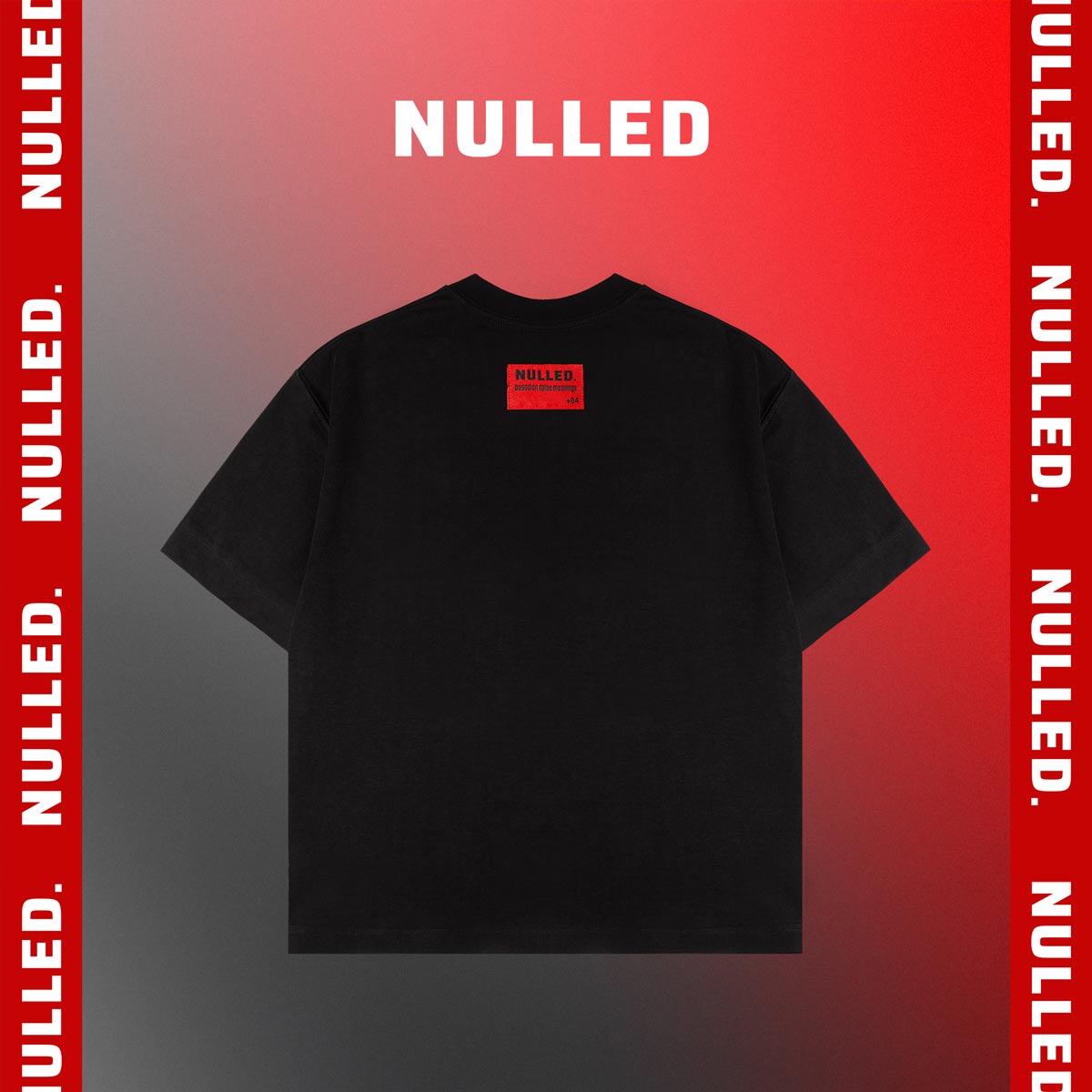Black t-shirt with 'NULLED' logo on a red and gray gradient background