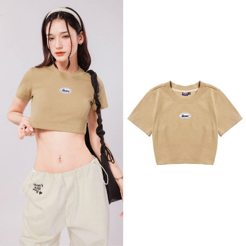 Woman wearing a beige crop top with a brand logo, next to a close-up of the same crop top on a white background.
