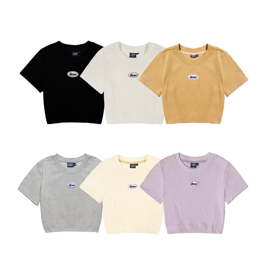 Set of six crop top shirts in black, white, beige, gray, yellow, and purple with a brand logo on a white background.