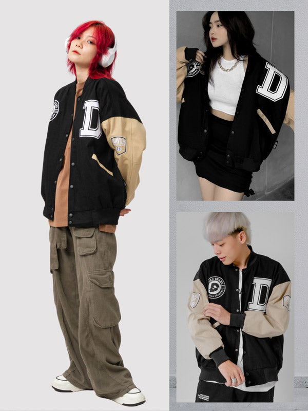 Three people wearing a black and beige varsity jacket with letter 'D' design.