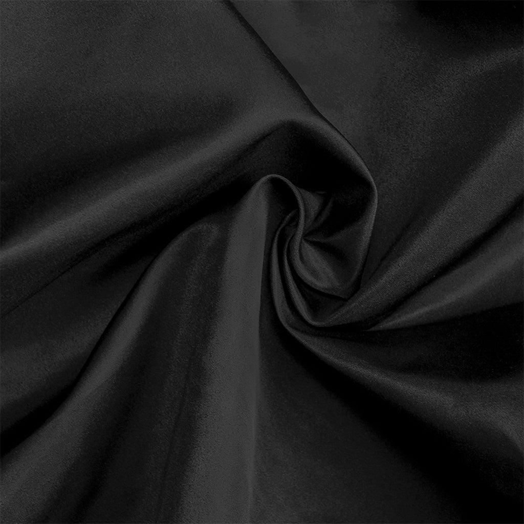 Dark gray fabric with folds on a black background