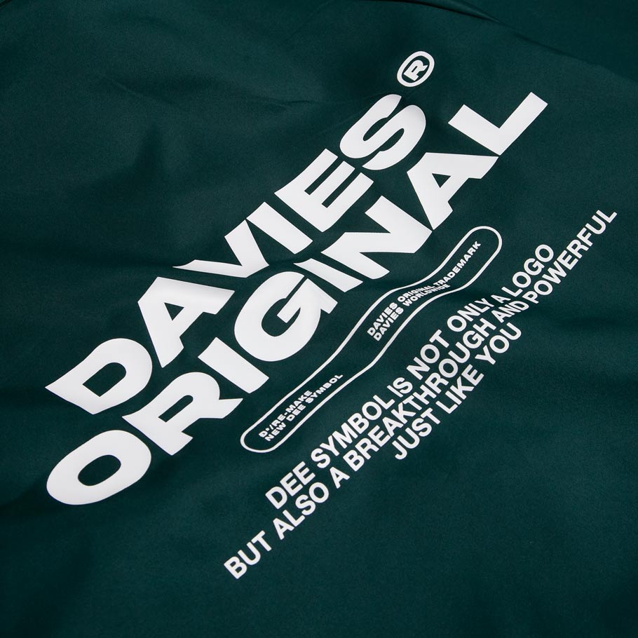 Green t-shirt with 'DAVIES ORIGINAL' text and branding on a dark green background