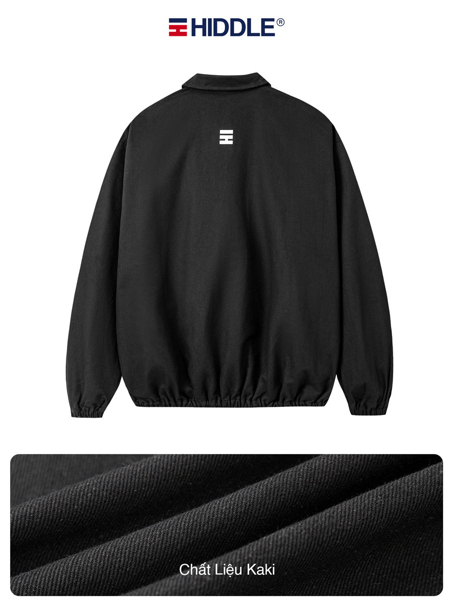 Black jacket with a logo on the back, displayed against a white background.