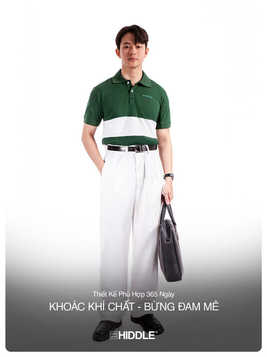 Man wearing a green and white polo shirt with white pants, holding a black briefcase on a white background.