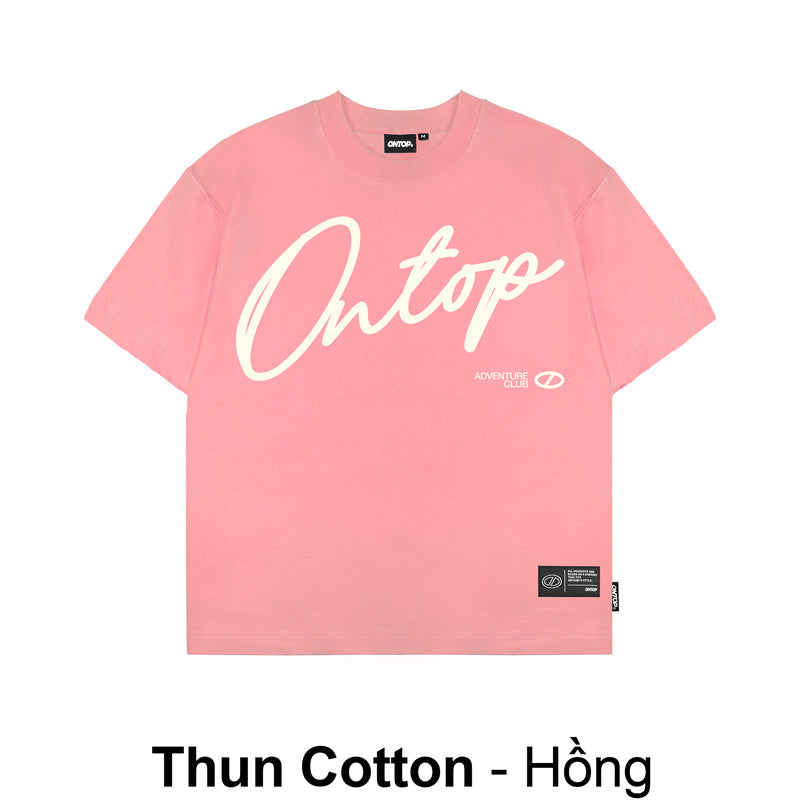 Pink t-shirt with white text on a white background