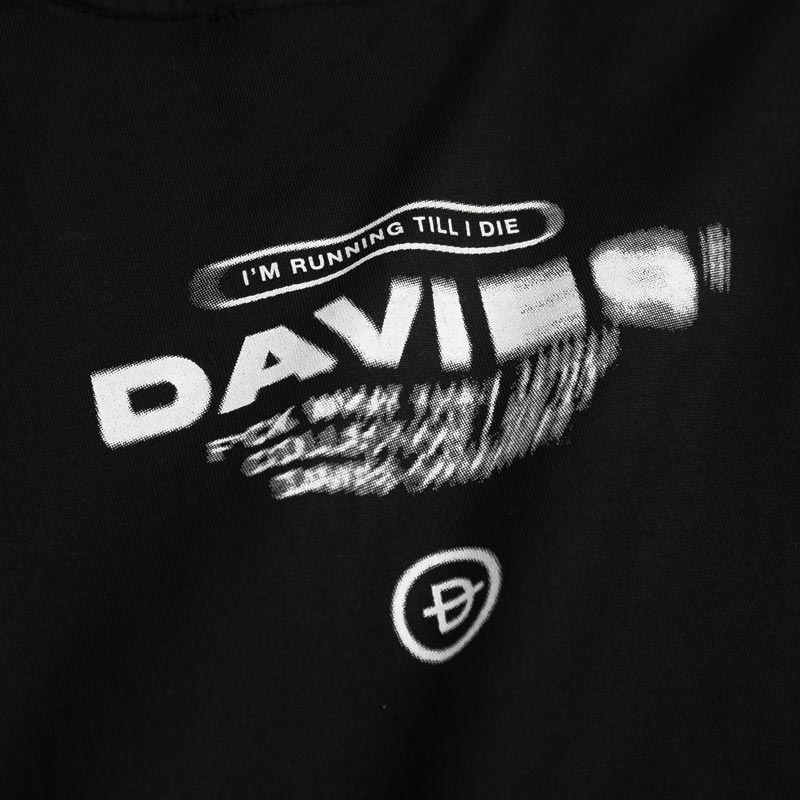 Black t-shirt with white text and graphics on a dark background