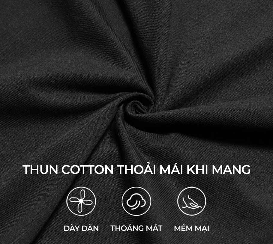 Black fabric with text and icons indicating cotton properties