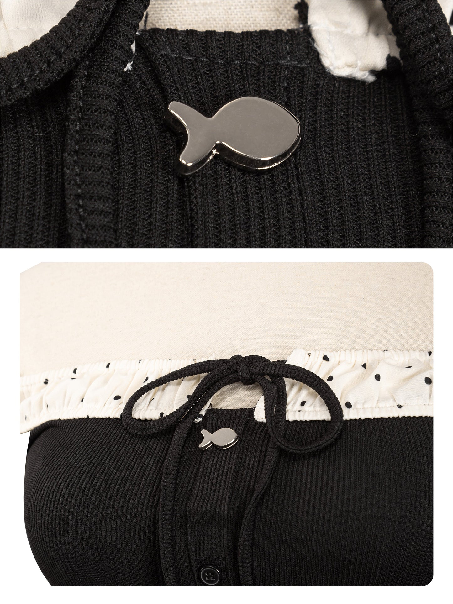 Black sweater with a fish-shaped button on a white background
