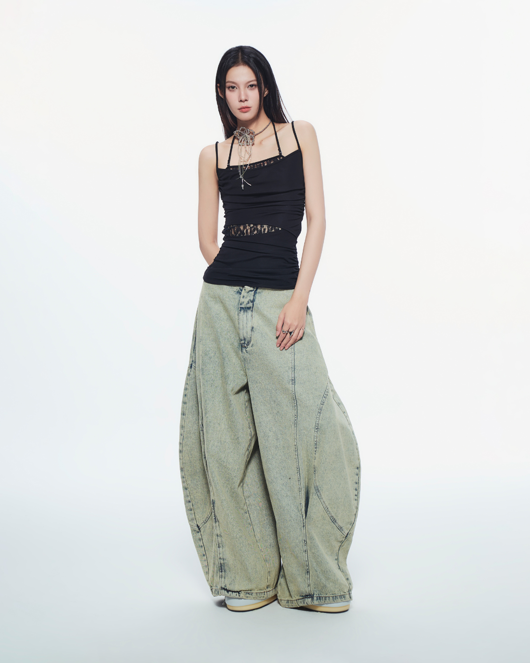 Lace-accented black top styled with skirt