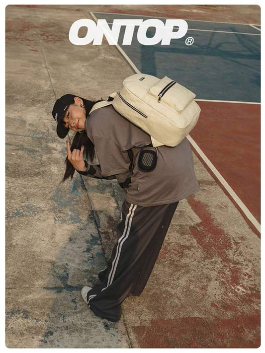 Person with a large backpack on a court, with 'ONTOP' branding.