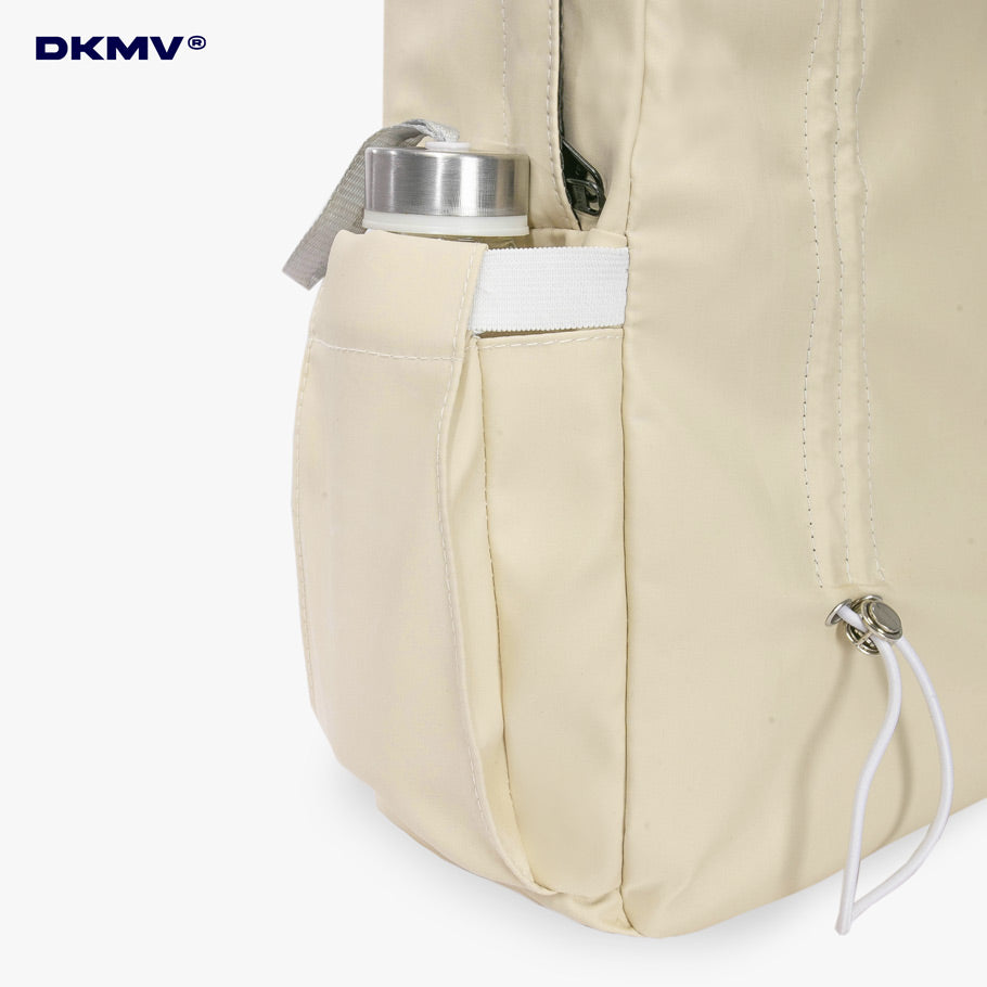 Beige backpack with water bottle holder on a white background, featuring the DKMV brand.