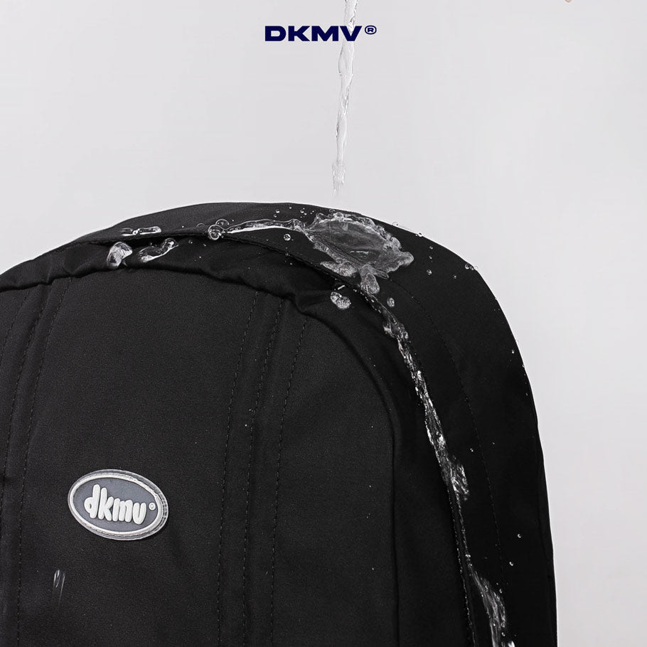 Black backpack with water splashing on it, featuring the DKMV logo.