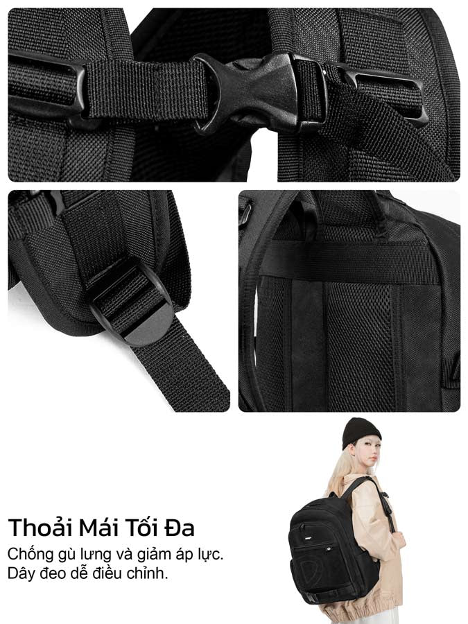 Black backpack with adjustable straps and a person holding it.
