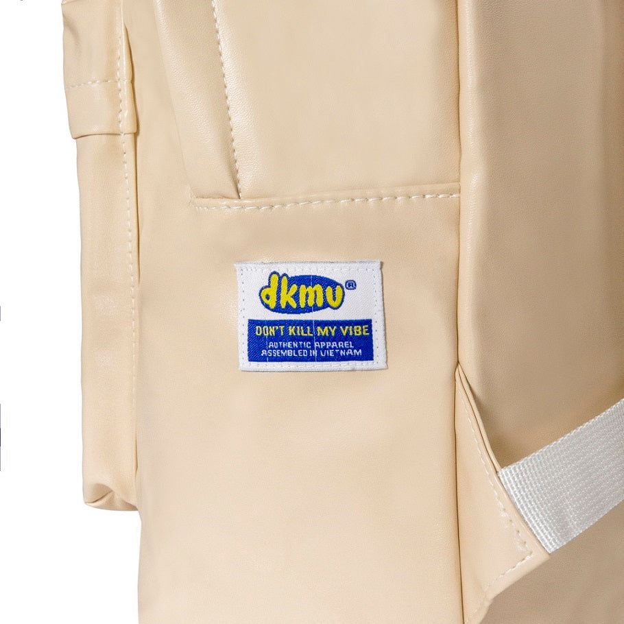 Beige jacket with a visible brand label on a white background