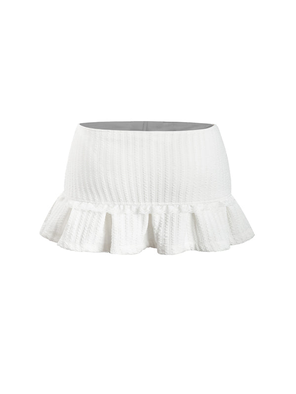 White skirt with ruffled hem on a white background