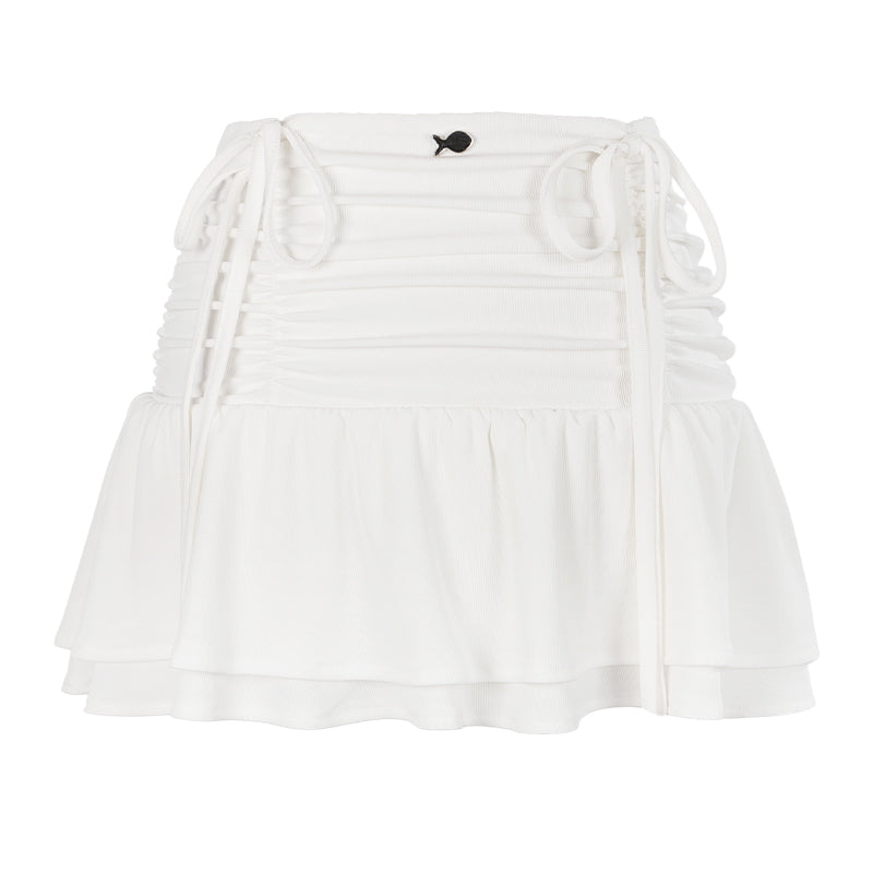 White off-shoulder top with ruffled details on a white background