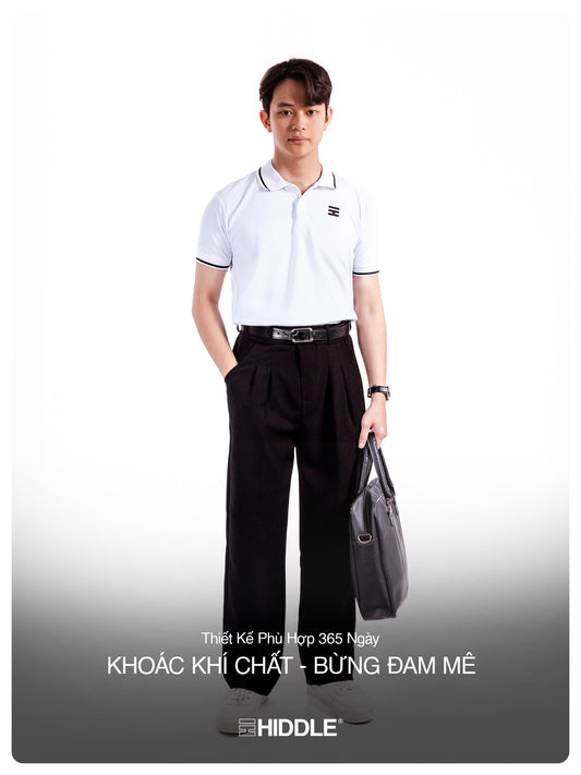 Man wearing a white polo shirt and black pants with a gray bag on a white background