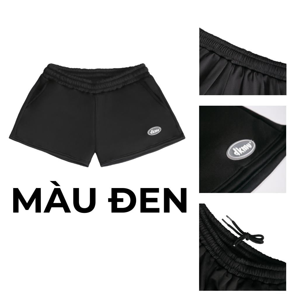 Black shorts with brand logo on a white background, labeled 'M u Den'.