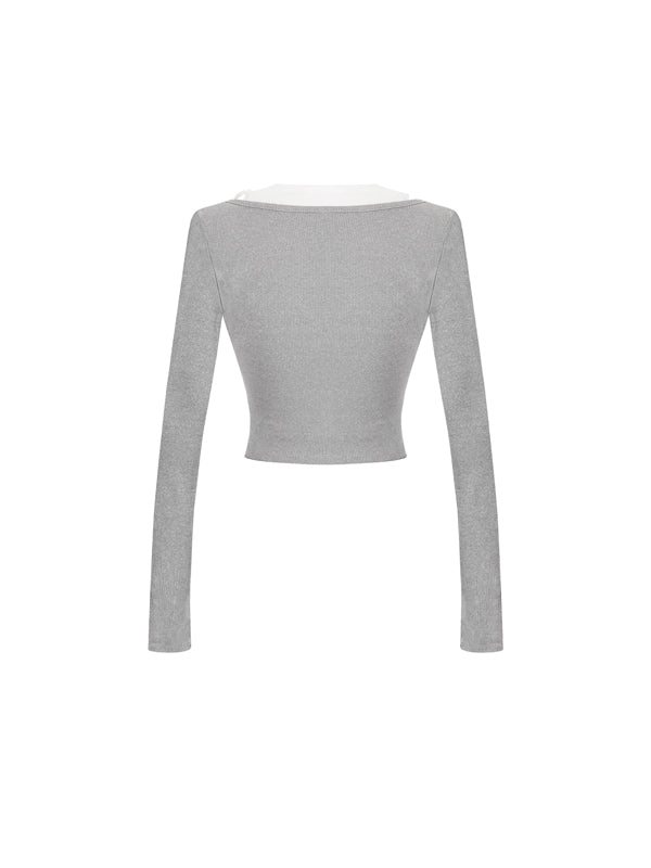 Gray long-sleeve crop top on a white background