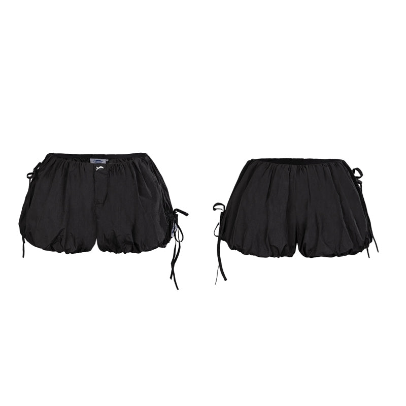 Black shorts with drawstring on a white background