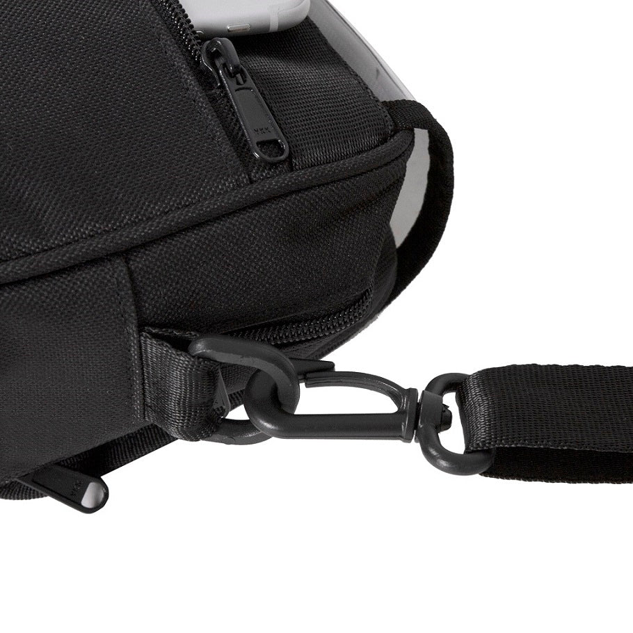 Black backpack with a strap on a white background