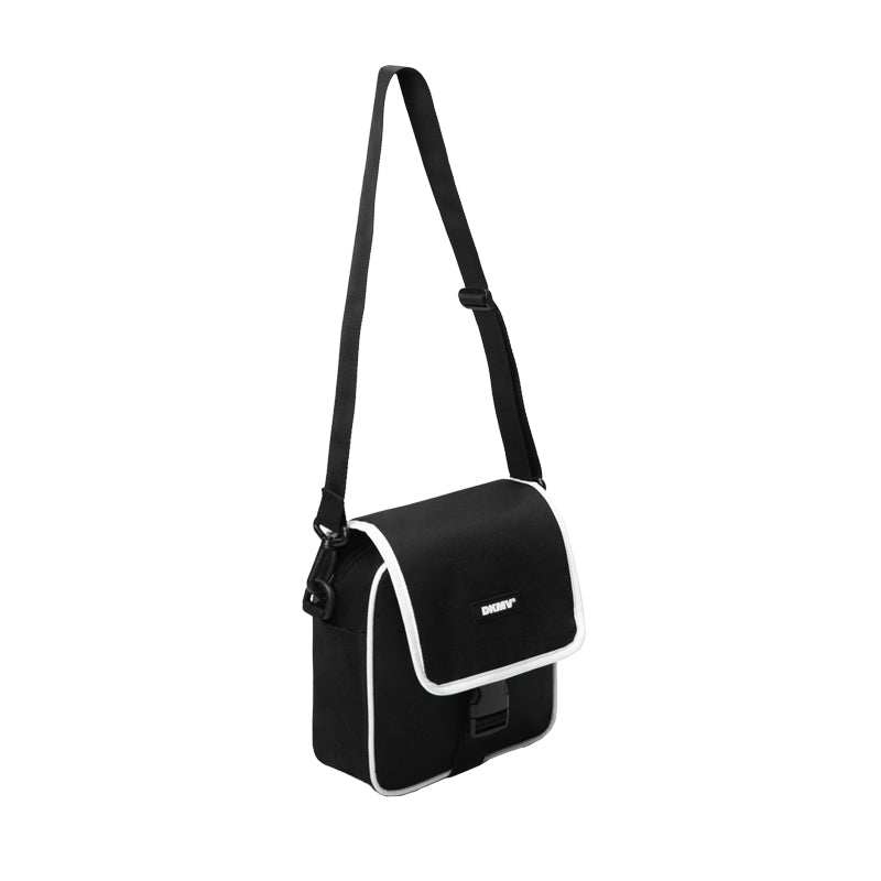 Black shoulder bag with a strap on a white background