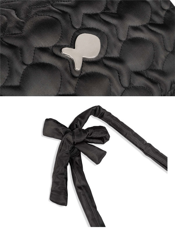 Black quilted bag with floral pattern and black ribbon on a white background