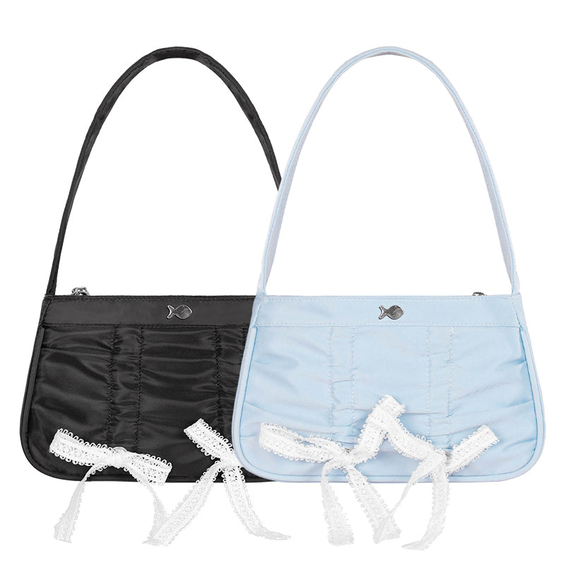 Black and light blue handbags with lace details on a white background