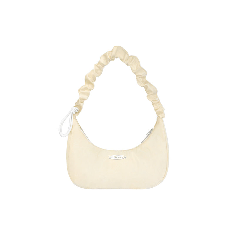 Cream-colored handbag with a ruched handle on a white background
