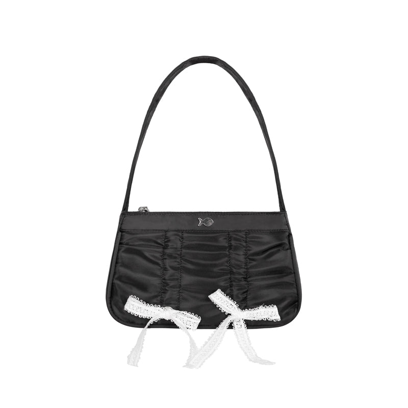 Black handbag with white lace details on a white background
