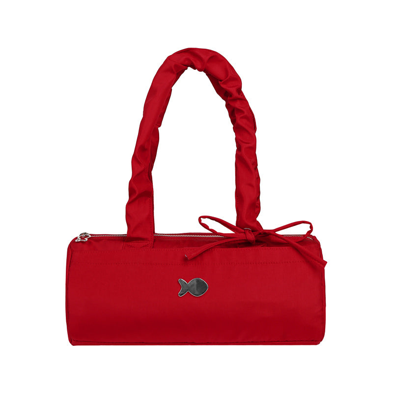 Red handbag with a bow on a white background
