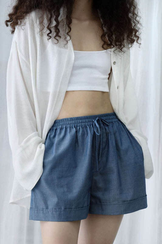 Close-up of fabric texture on striped shorts