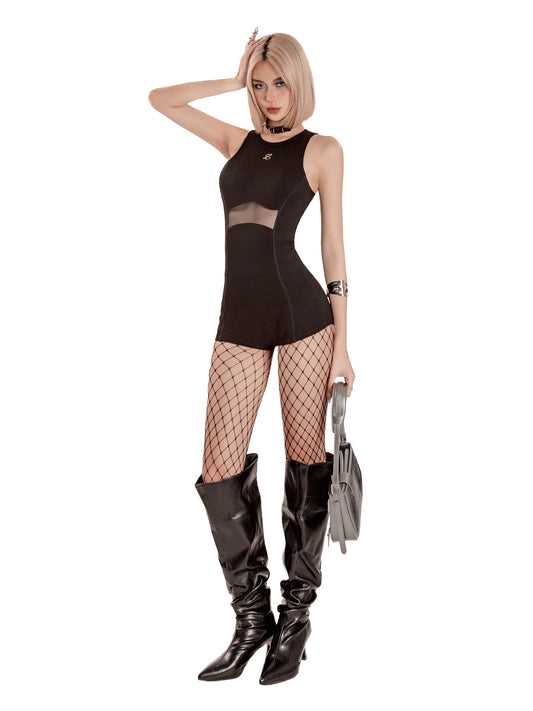 Woman in a black outfit with fishnet stockings and high boots on a white background