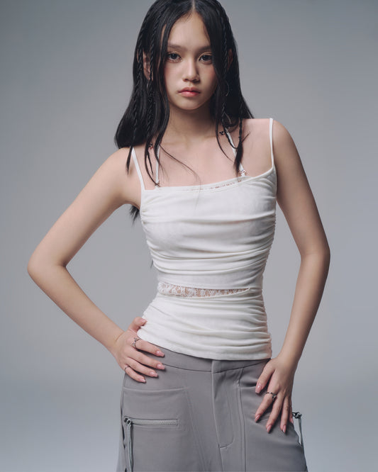 Feminine white lace top for layering – close-up