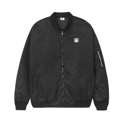 Black bomber jacket with a logo on a white background