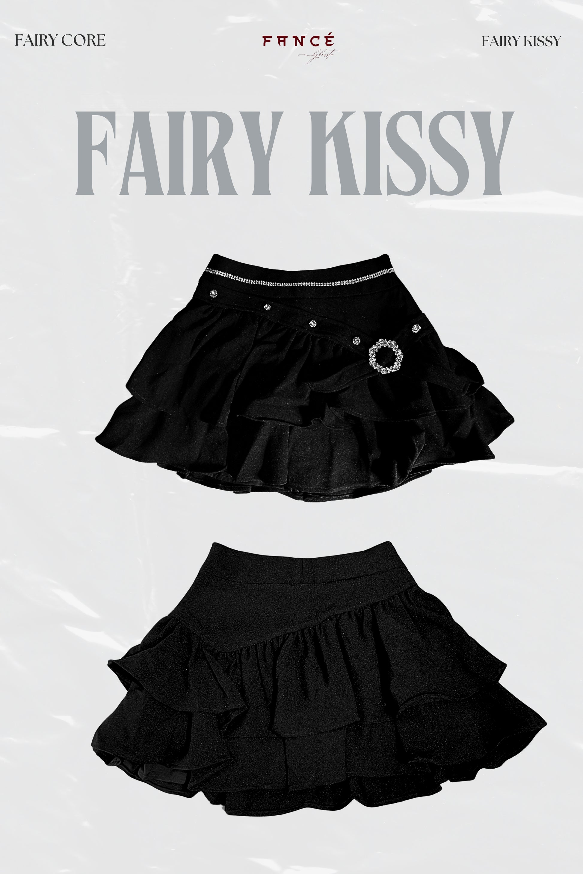 Black ruffled skirt with decorative elements on a white background, featuring the brand 'Fairy Kissy'.