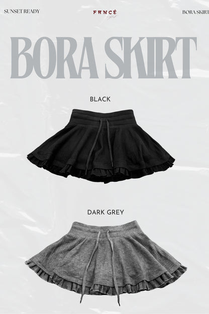 Black and dark gray skirts with 'Bora Skirt' branding on a white background.