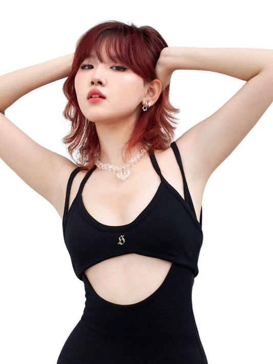 Woman wearing a black dress with cut-out design on a white background