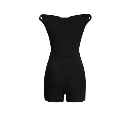 Black strapless romper on a white background
