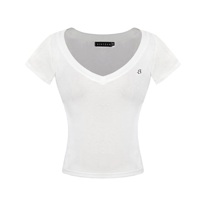 White crop top with a brand label on a white background