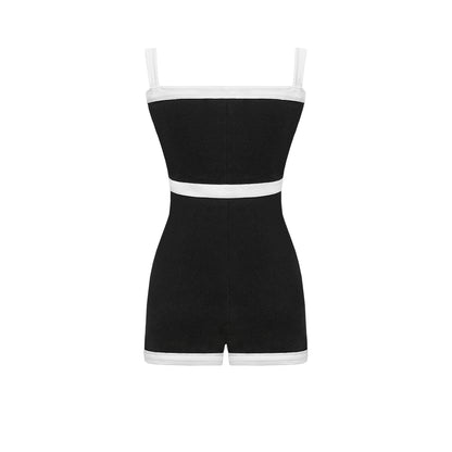Black romper with white waistband on a white background